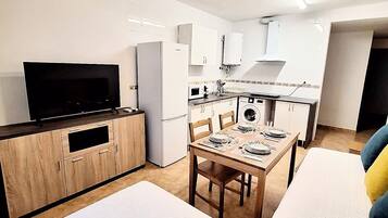 1 bedroom, desk, iron/ironing board, travel crib