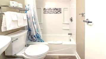 Shower, hair dryer, towels, shampoo