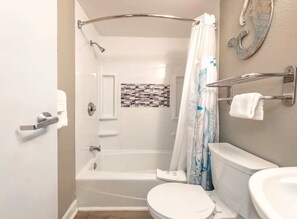 Shower, hair dryer, towels, shampoo