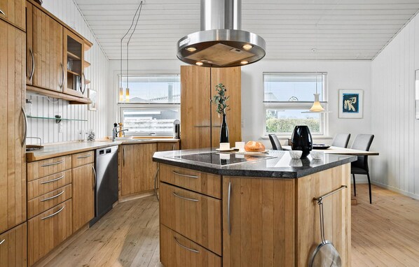 Fridge, stovetop, dishwasher, coffee/tea maker