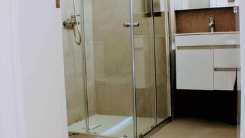 Shower, towels, soap, toilet paper