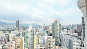 A high-rise urban area with dense residential buildings and a clear sky.