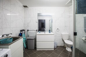 Shower, towels, soap, toilet paper