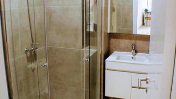 Shower, towels, soap, toilet paper