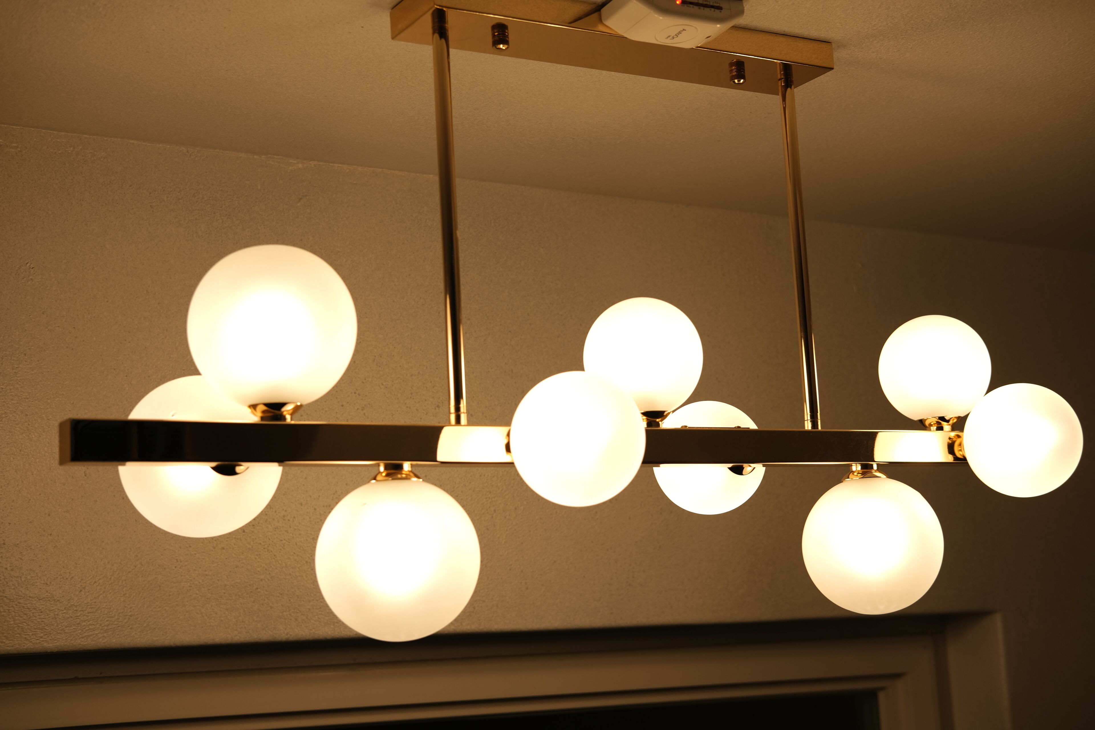 A ceiling light fixture with multiple spherical bulbs.