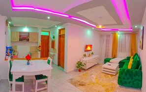 Business Apartment | Living area | 24-inch Smart TV with digital channels - Lux Suites Alpha Apartment Nanyuki (Nanyuki)