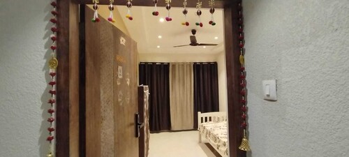 1BHK flat fully furnished bedroom, hallway with single bed balconies.