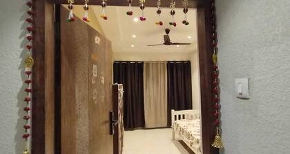 1BHK flat fully furnished bedroom, hallway with single bed balconies.