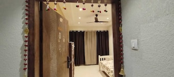 1BHK flat fully furnished bedroom, hallway with single bed balconies.