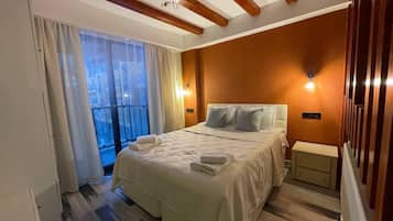 Departamento | 1 habitación, tabla de planchar con plancha, wifi gratis y ropa de cama