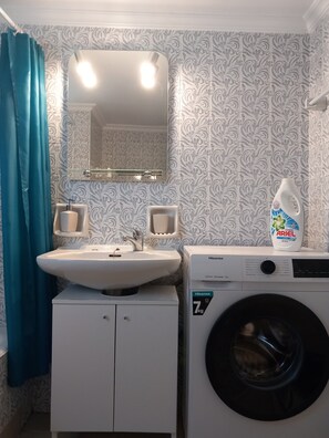 Hair dryer, towels, soap, shampoo