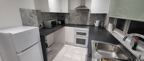Apartment | Private kitchen | Fridge, microwave, oven, stovetop