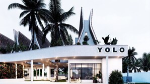 A modern building with the name 'YOLO' prominently displayed.