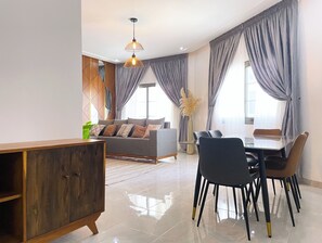 Signature Apartment | Living area | 32-inch Smart TV with digital channels - Lighthouse Signature Suites (Dakar)