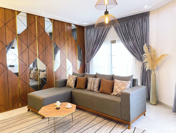 Signature Apartment | Living area | 32-inch Smart TV with digital channels - Lighthouse Signature Suites (Dakar)