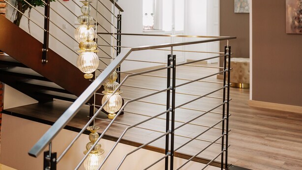 A modern staircase with glass railings and hanging pendant lights. - Casa Gallo-Adults Only Sibiu (Sibiu)