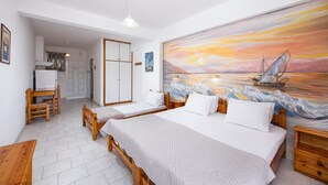 A room with two beds, a desk, and a chair. There is a painting of a sunset on the wall. - Zoe Seaside (Istiaia-Aidipsos)