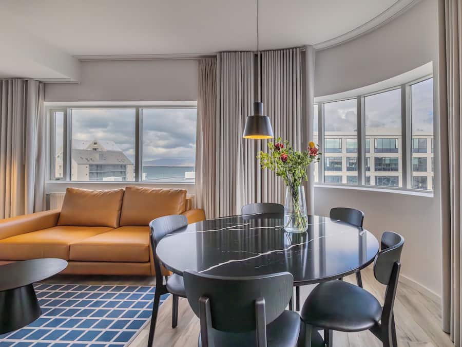 Deluxe Two Bedroom Apartment | Living area | 40-inch Smart TV with digital channels