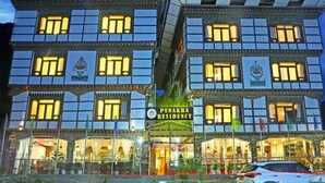 A multi-story building with a sign reading "Punakha Residency." - Punakha Residency Hotel (Punakha)