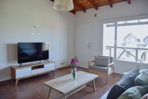 Deluxe Apartment | Living area | Smart TV