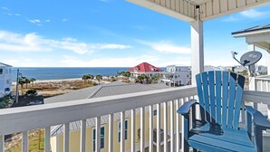 A balcony with a view of the beach and ocean. - Huge renovated townhome, sleeps 11, beach-side of 98 with gorgeous beach access (Me)