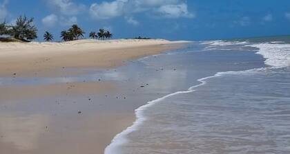 House in a gated community surrounded by green spaces 150 meters from the beach.