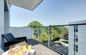 Enjoy a peaceful breakfast on the balcony with a clear view of the surrounding area.