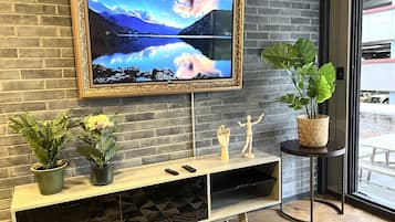 Apartamento elite | Área de estar | TV