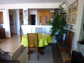 Enjoy meals in this cozy dining area with a round table and comfortable chairs.