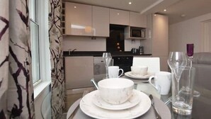 A modern kitchen with a dining area. - Home from home in style & comfort (Chester)