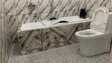 Appartement Deluxe | Salle de bain | Serviettes fournies