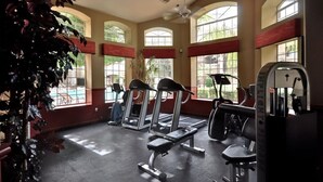 A gym with treadmills, elliptical machines, and weight benches. - Amazing Casita with Upgrades Galore! (Scottsdale)