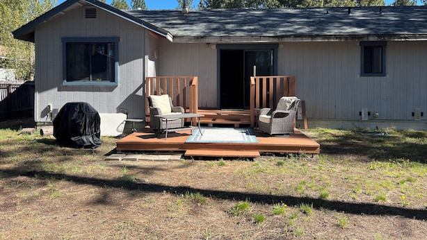 A single-story house with a porch, outdoor seating, and a covered grill area. - Cozy 3BR Home in Chester Near Lake Almanor and Mt Lassen (Chester)