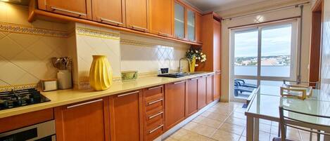 Fridge, coffee/tea maker, toaster, cookware/dishes/utensils
