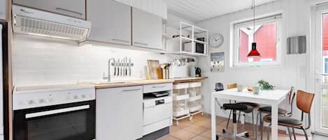 Fridge, stovetop, dishwasher, coffee/tea maker