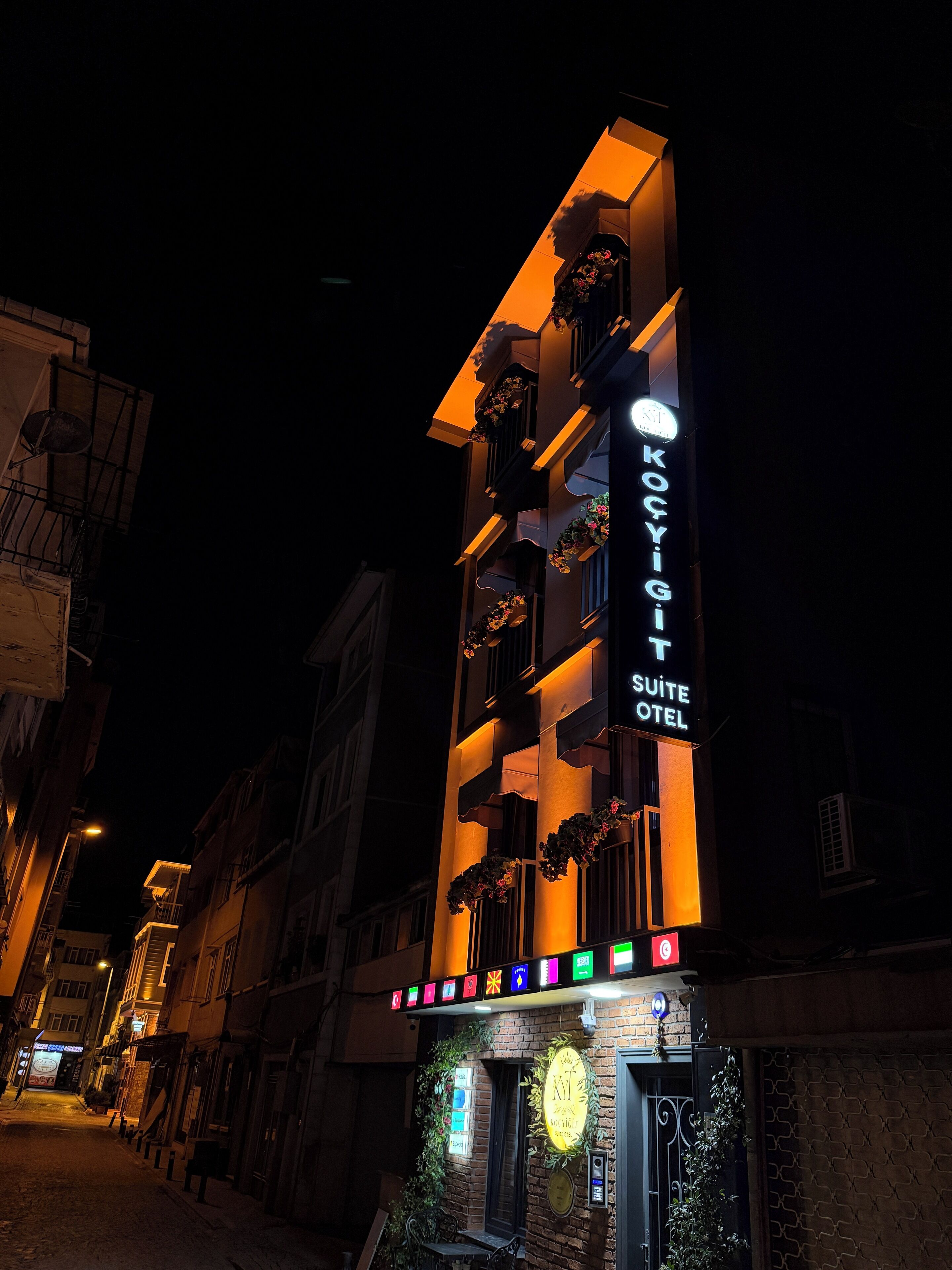 A hotel with a sign reading "KOÇYIĞI SUITE HOTEL".