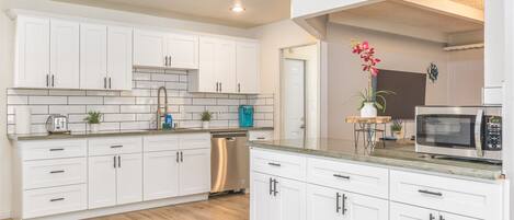 Fridge, microwave, dishwasher, cookware/dishes/utensils