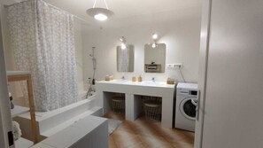 Shower, hair dryer, towels, toilet paper