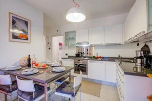 Family Apartment, Multiple Bedrooms (Lenni Apart. Swimming Pool and lake) | Private kitchen | Fridge, oven, stovetop, dishwasher - Lenni Apart. Swimming Pool and Lake (Leggiuno)