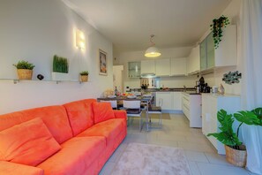 Family Apartment, Multiple Bedrooms (Lenni Apart. Swimming Pool and lake) | Living area | 21-inch flat-screen TV with cable channels - Lenni Apart. Swimming Pool and Lake (Leggiuno)