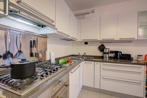 Family Apartment, Multiple Bedrooms (Lenni Apart. Swimming Pool and lake) | Private kitchen | Fridge, oven, stovetop, dishwasher - Lenni Apart. Swimming Pool and Lake (Leggiuno)