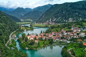 A town with a river, surrounded by mountains. - House Naturalina With Pool Near Tolmin (Tolmin)