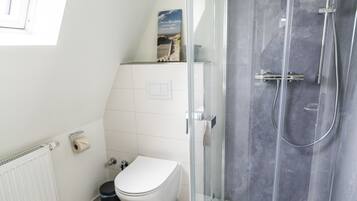 Shower, hair dryer, towels, toilet paper