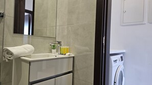 Shower, hair dryer, towels