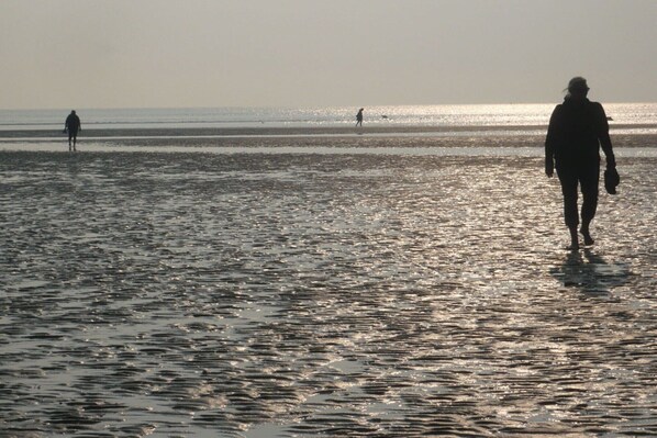 Walking along the shoreline, guests can enjoy the wide, open beach.