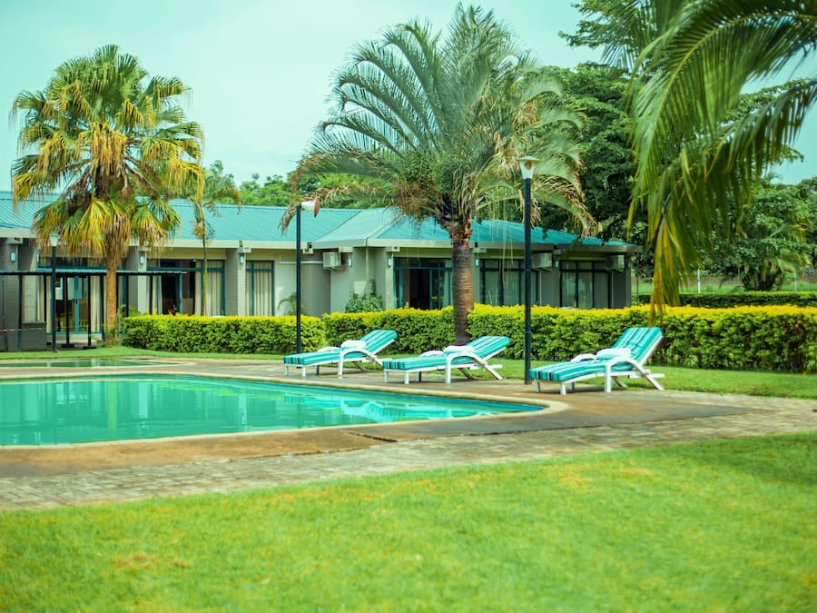 Outdoor pool, pool loungers, lifeguards on site
