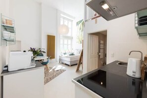 Enjoy meals in the kitchen with a sink and dining area nearby.