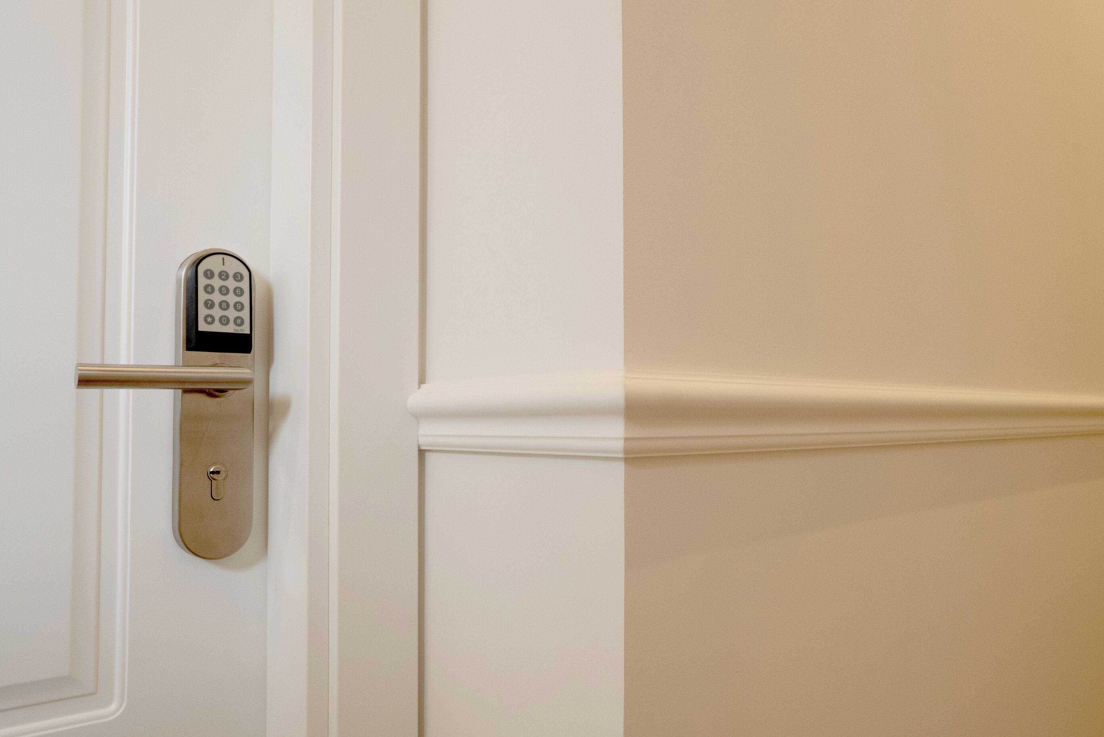A door with a modern electronic lock.