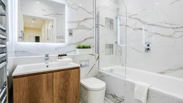 Separate tub and shower, hair dryer, towels