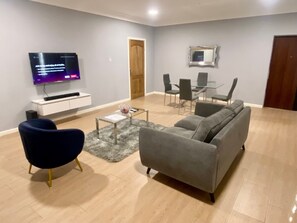Luxury Apartment | Living area | 50-inch Smart TV with satellite channels, Netflix, smart speakers